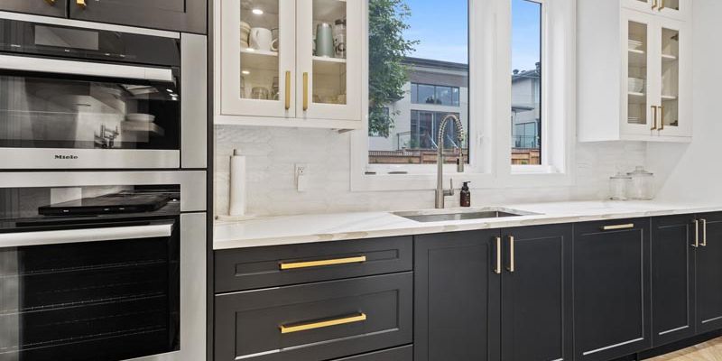 Custom black cabinets with gold finish.