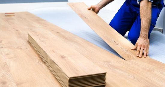 wood flooring panels being installed