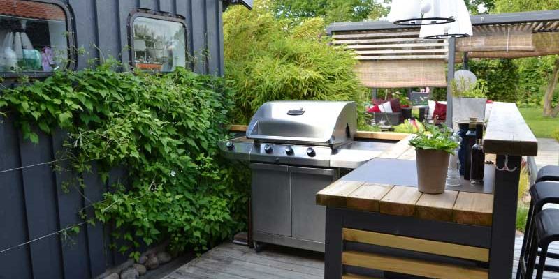 Outdoor kitchen with a grill.