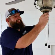 CrewPros employee changing a fixture.